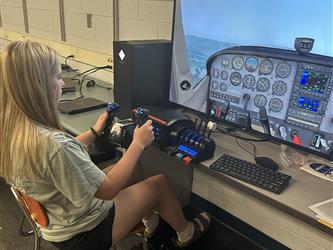 Student using flight simulator